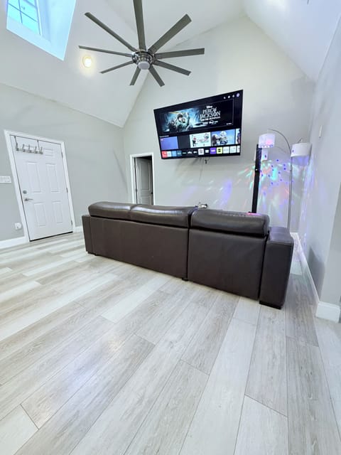 86in tv with Roku daybed and disco lights with party speaker/mic karaoke combo