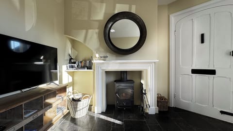 Our cosy front room includes a log burner & satellitel TV with streaming apps
