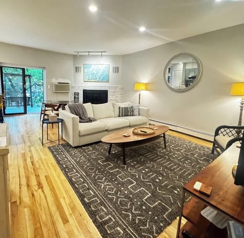 Comfortably laid out living area that flows into a small dining area and out to the garden.