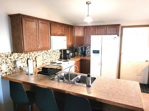 KITCHEN: The home has a cute and modern kitchen with all appliances, except for a dishwasher.