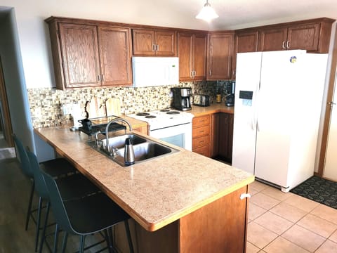 KITCHEN: The home has a cute and modern kitchen with all appliances, except for a dishwasher.