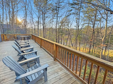Relax on the expansive deck and soak in peaceful forest and golf course views