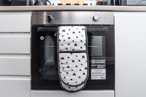 Modern oven with essentials provided for easy self-catering.