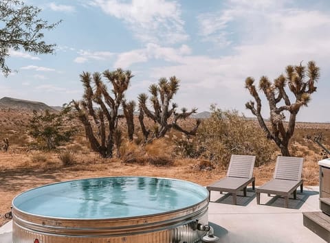 Cool off in the cowboy tub soaking pool overlooking miles of open desert vistas