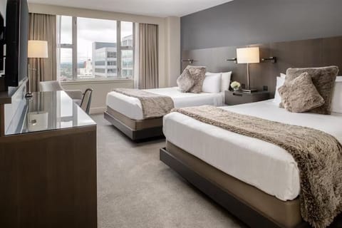 Linger longer with dual rain heads and a heated shower bench.