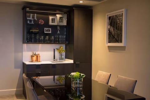 Host an intimate dinner with modern kitchenette conveniences nearby.