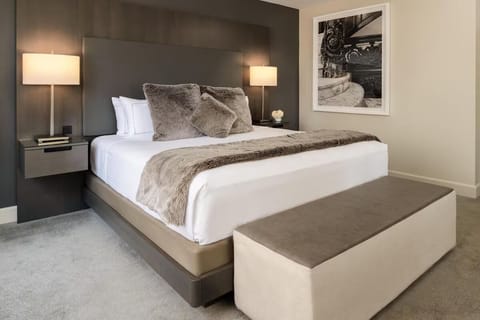 Sink into cloud-soft linens and unwind under warm lamps.