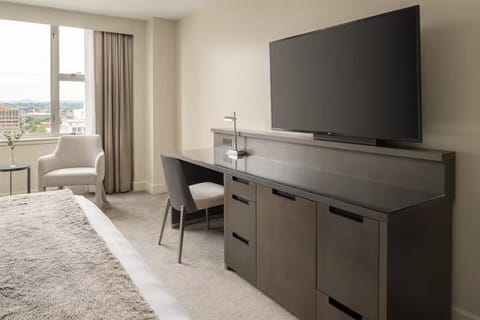 Catch up on work at the sleek desk, then stream easily.