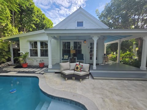 1933 home with wrap around porch. Just two steps! Heated pool with waterfall.