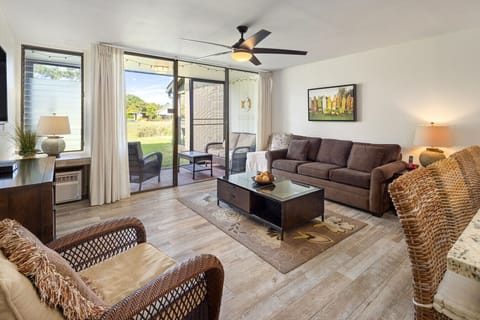 Sunlit living room opens to the patio for easy lounging & breezy mornings.
