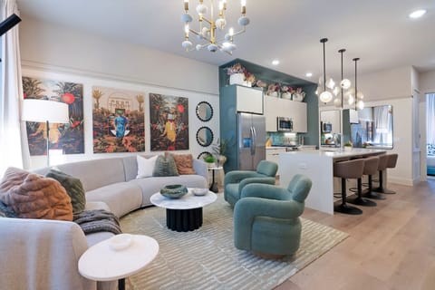 Living room with fully stocked kitchen