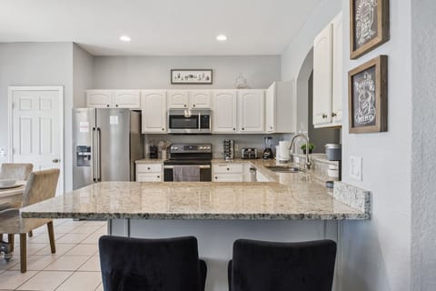 Fully equipped kitchen with stainless steel appliances