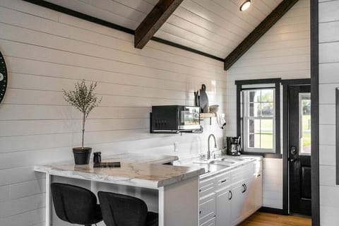 Enjoy meals at the kitchenette bar with seating for two.