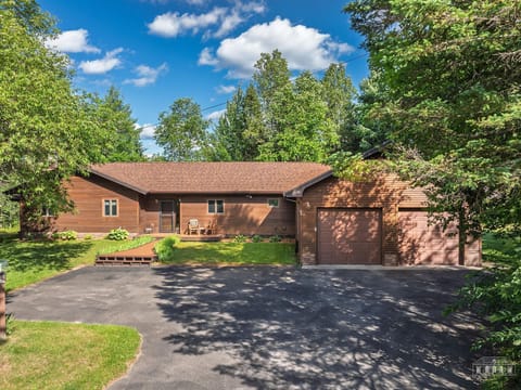 Welcoming front yard with ample parking in the driveway.