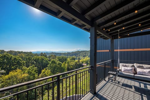Enjoy the relaxing porch swing with views of the mountains