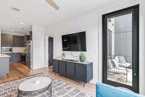 Open-concept living space with modern appliances.