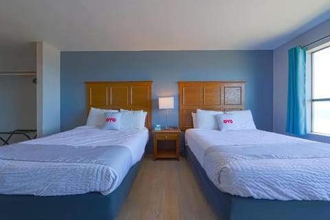 Stretch out together with two comfy beds and soft lighting.