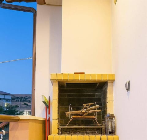 Enjoy cozy evenings on our terrace with this charming built-in fireplace — perfect for grilling or relaxing under the soft glow of the evening light and beautiful sunset views.