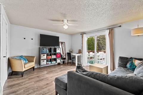 Relax in your bright, comfortable living room where you can unwind on the plush sofa while watching your favorite shows. Step through the glass doors to your private balcony.