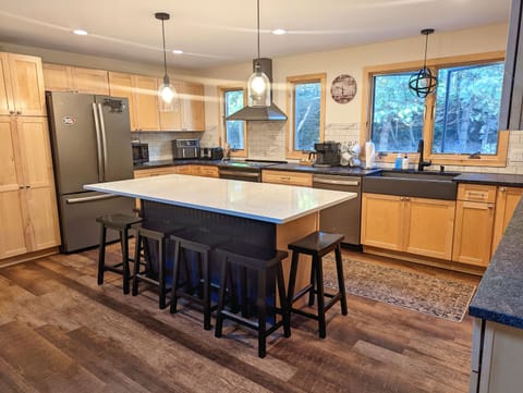 Our large kitchen is the perfect central gathering place. Pull up a barstool and let the good times roll.