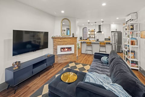 Open floor plan with kitchen, living room and two spaces to gather and dine