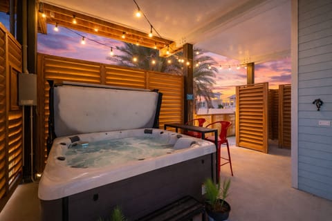 Cozy private hot tub retreat with privacy walls and ambient lighting for ultimate relaxation.
