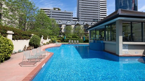 Relax by the pool with scenic views and a serene atmosphere, ideal for unwinding.