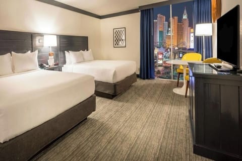 Stretch out with two plush beds and cozy seating nook.