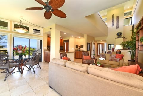    Elegant open-concept living with ocean view and tropical floral accents. KRV-1223