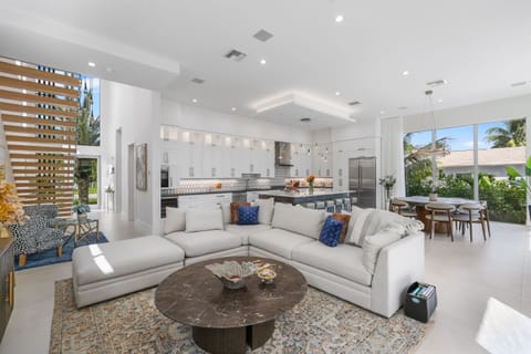 Tropical privacy meets designer luxury – enjoy 4,200 sq. ft. of refined living space with lush landscaping and secure gated entry.