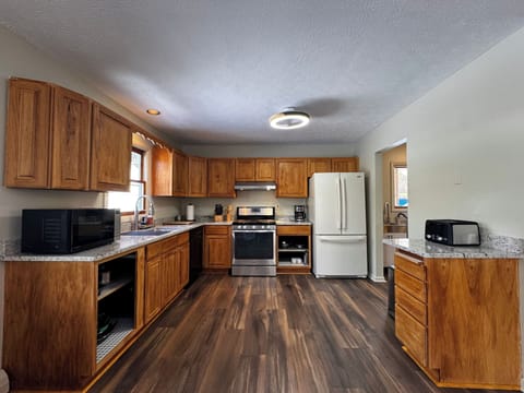 Full kitchen opens to attached dining room.