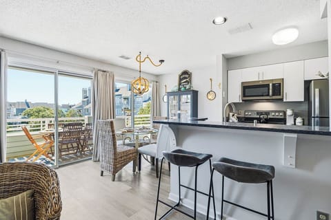 Main-Level Dining Room with Table (seats 2) and Deck Access