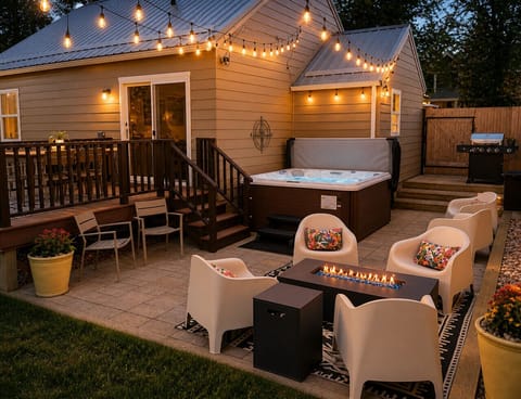 Inviting backyard with fire table and new hot tub