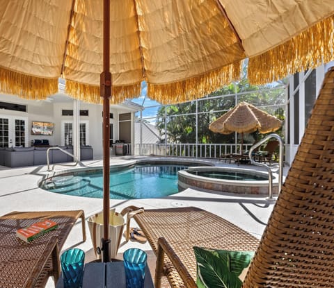 Unwind on poolside chaises facing the elegant lanai, where sparkling water and refined design meet pure relaxation.