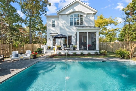 Photos shown represent a comparable new build and reflect the anticipated layout, finishes, and high-end coastal quality of this home.