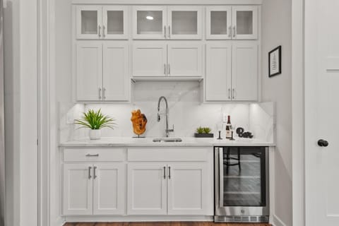 Photos shown represent a comparable new build and reflect the anticipated layout, finishes, and high-end coastal quality of this home.