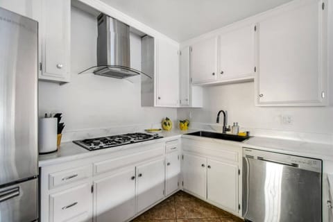 Fully equipped kitchen with modern appliances and plenty of space to cook and gather.