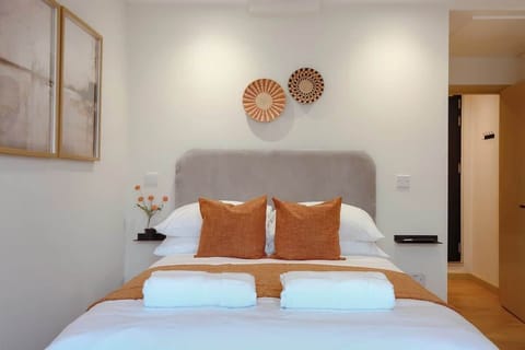 Comfortable and relaxing bed with towels and fresh linens