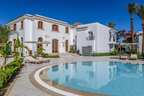 Enjoy quiet mornings by the calm pool under deep blue skies.