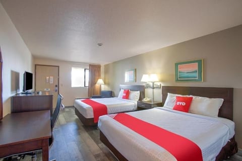 Unwind in a bright double-queen room with relaxing space.