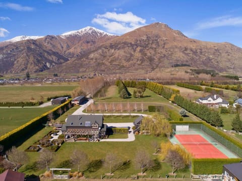 Expansive estate with tennis court and gardens – Surrounded by breathtaking mountain views.