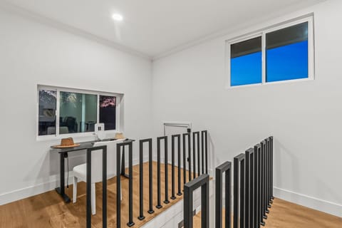 Twin bedroom with simple, clean design and natural light