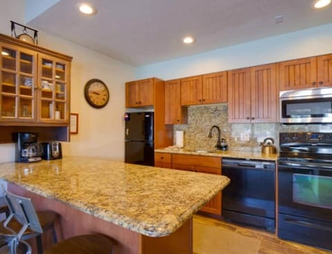 Fully stocked kitchen with plenty of cabinet space.