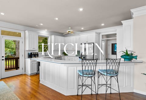 Whip up meals in this pristine, open kitchen — complete with lake views and room to gather.