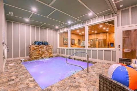 Indoor Pool Oasis. Slip into relaxation mode with a stunning waterfall feature, jetted streamers and vibrant ambiance!
