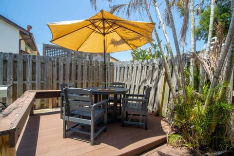 Tropical backyard oasis with patio furniture- perfect for entertaining!