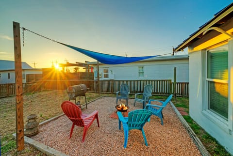 Backyard setup with fire pit, grill, and sunset views—perfect for evenings outdoors.