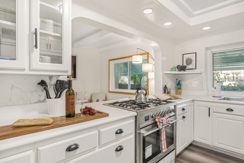 A fully equipped kitchen area with ample counter space for meal preparation.