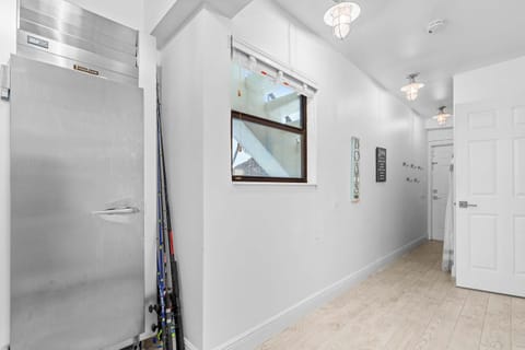 Gear up for the water. Fishing rods ready and a massive stainless fridge for all your catches.