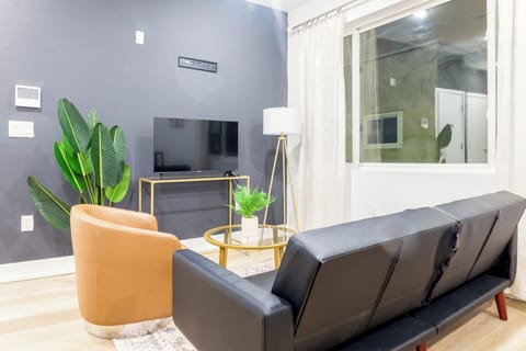Comfort meets entertainment in this inviting TV room